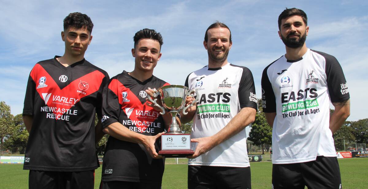 UP FOR GRABS: Eagles Daniel Fabrizio and Keanu Moore, and Magpies Carl Thornton and Nick Cowburn with the grand final trophy. Picture: NNSWF