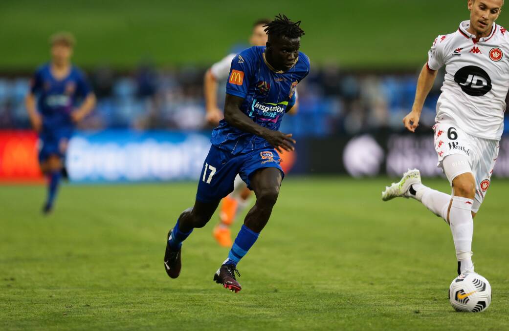 HEAD DOWN: Valentino Yuel on the charge against Western Sydney Wanderers on January 8. Picture: Jonathan Carroll