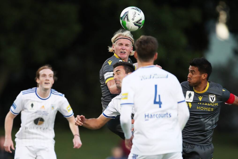 ON TOP: Macarthur goalscorer Lachie Rose rises for a header in the 3-0 win over Newcastle Olympic on Saturday at No.2 Sportsground. Picture: Getty Images