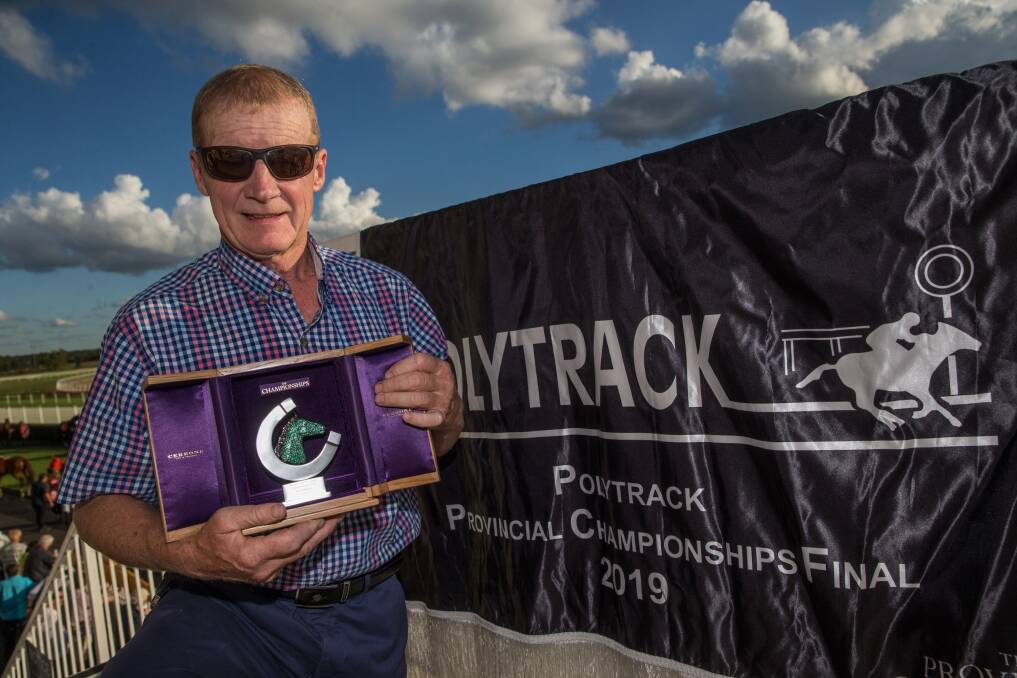 Trainer Bernie Kelly with the Provincial Championship silverware. Picture: Geoff Jones