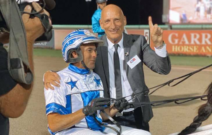 NO.1: Owner Kevin Gordon with trainer-driver David Moran after the Chariots of Fire win. Picture: Club Menangle
