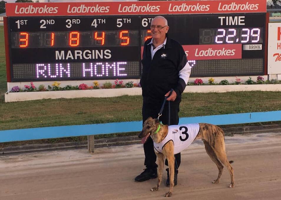 Frank Hurst and Good Odds Tyson on Monday night. Picture: Maitland Greyhounds