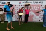 Surfest winners Joel Vaughan and Ellie Harrison, centre, get a champagne shower. Pictures by Jonathan Carroll
