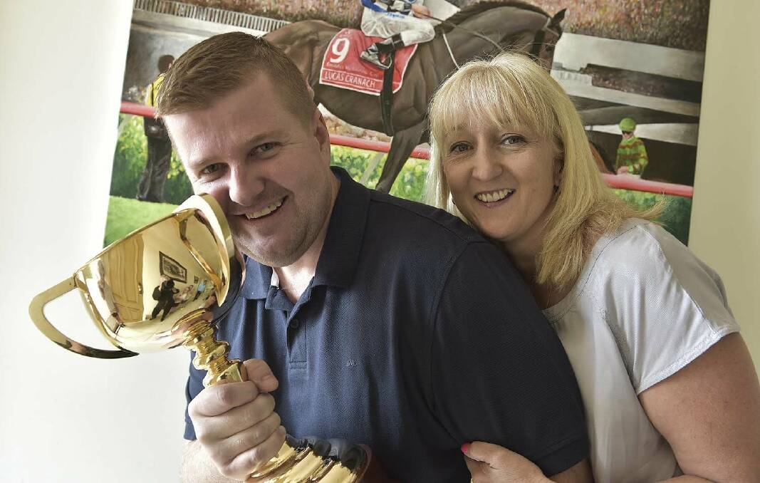 Luke Murrell and his wife, Sharyn, with the Melbourne Cup.