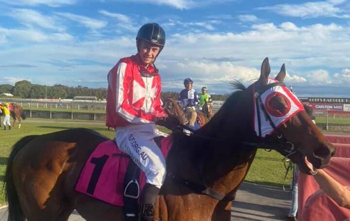 Dylan Gibbons returns a winner on Ocean Ruler on Saturday. Picture: Coffs Racing