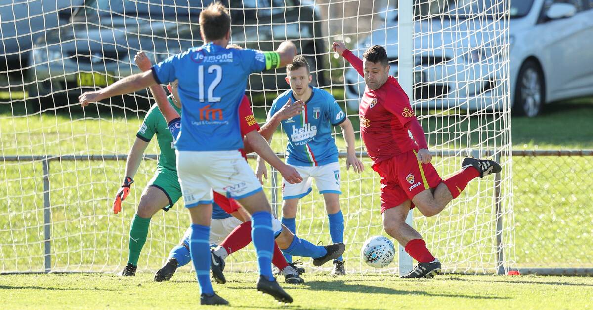 LINING UP: John Majurovski takes on the Charlestown defence in Broadmeadow's 3-1 win at Magic Park in round two. Picture: Max Mason-Hubers