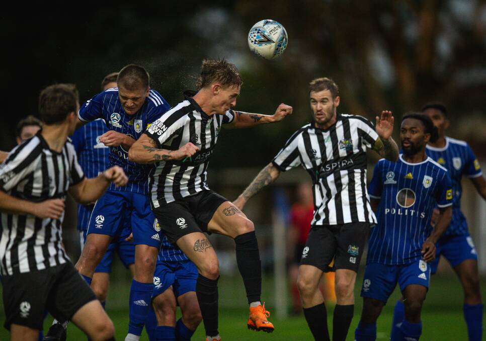 NPL action from Cooks Hill v Olympic this season. Picture: Marina Neil