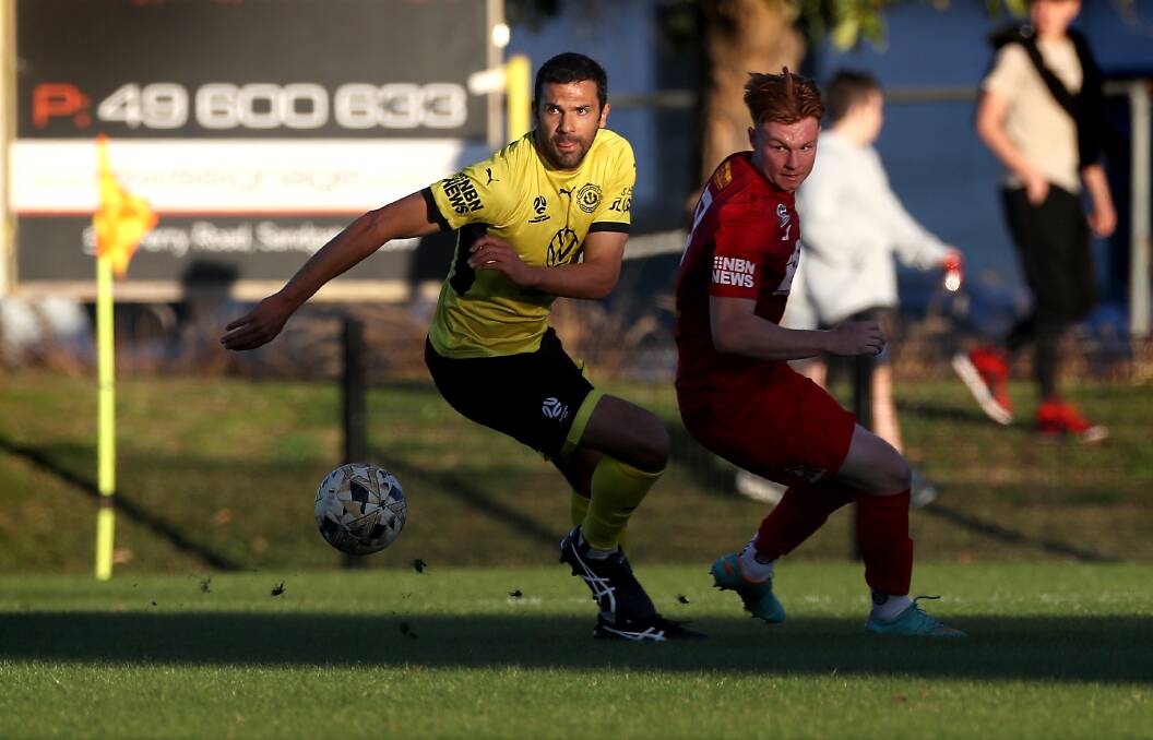 Nikolai Topor-Stanley, left, in action for Lambton Jaffas on Sunday against Broadmeadow at Arthur Edden Oval in round 16 of the NPL. Picture Sproule Sports Focus