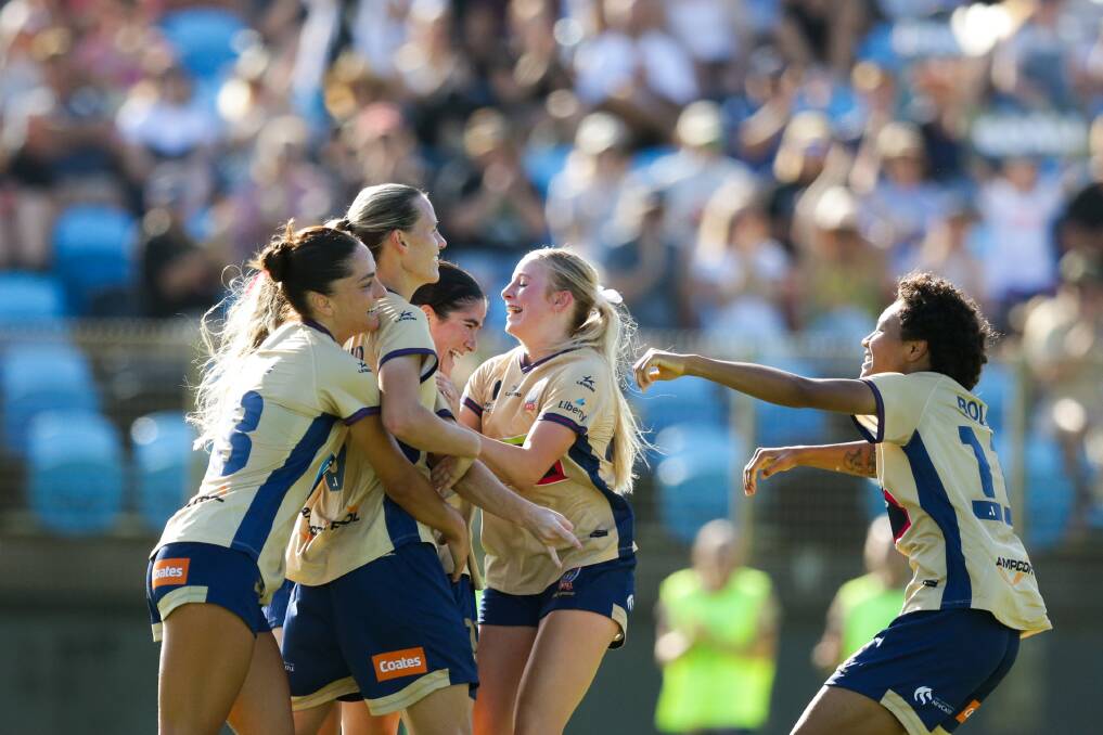 The Jets celebrate Lauren Allan's first goal on Sunday. Picture by Jonathan Carroll