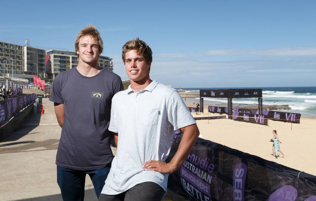 PAIR OF ACES: Merewether Surfboard Club teammates and championship tour rivals Ryan Callinan and Morgan Cibilic at Newcastle Beach on Friday ahead of the Australian Boardriders Battle final. Picture: Max Mason-Hubers 