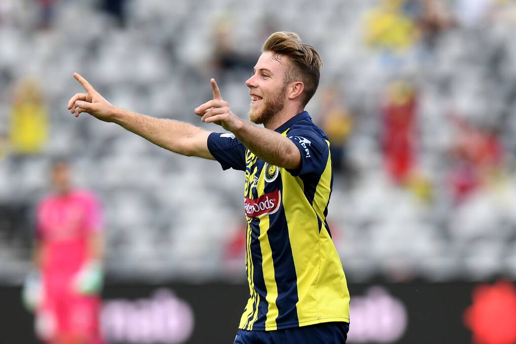 BACK: Former Newcastle and Sydney midfielder Andrew Hoole celebrates scoring a goal for the Central Coast Mariners against Melbourne Victory in February. Picture: AAP