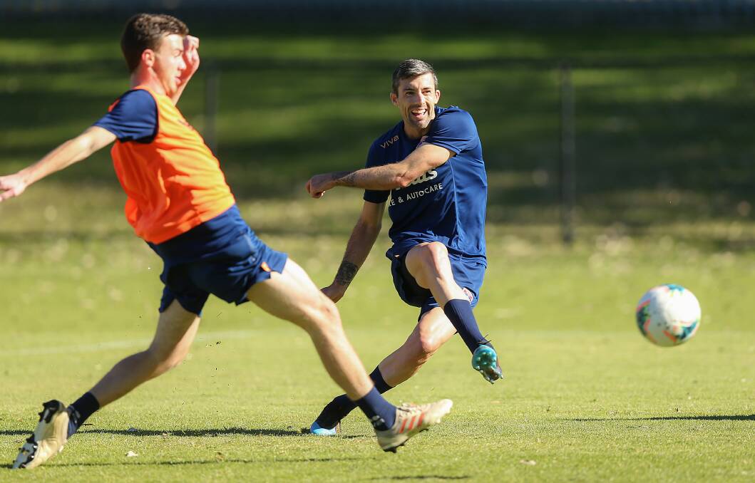 SMILING ASSASSIN: Jason Hoffman fires to score the opening goal of the Newcastle Jets intra-club trial match on Wednesday morning at Ray Watt Oval. Picture: Marina Neil