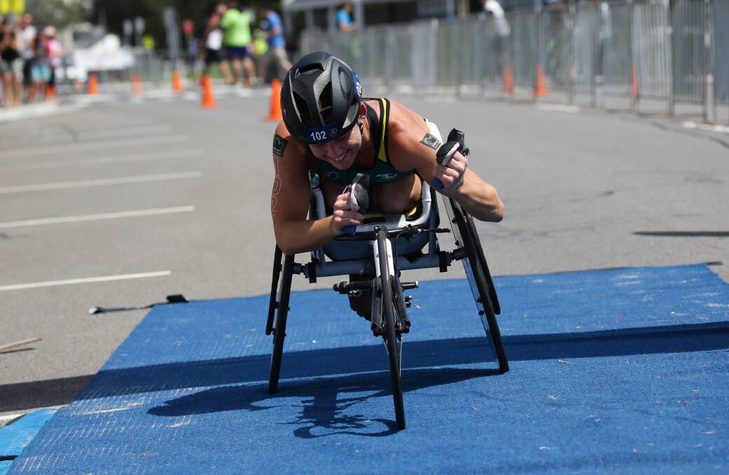DOUBLE DELIGHT: Lauren Parker winning the Oceania paratriathlon title on Newcastle Foreshore in February this year. Picture: Jonathan Carroll