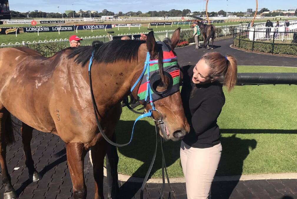 HOPEFUL: Trainer Aleacia Bennett with Buddy Honest after he gave her a maiden city winner in 2017 at Rosehill. Picture: Racing NSW