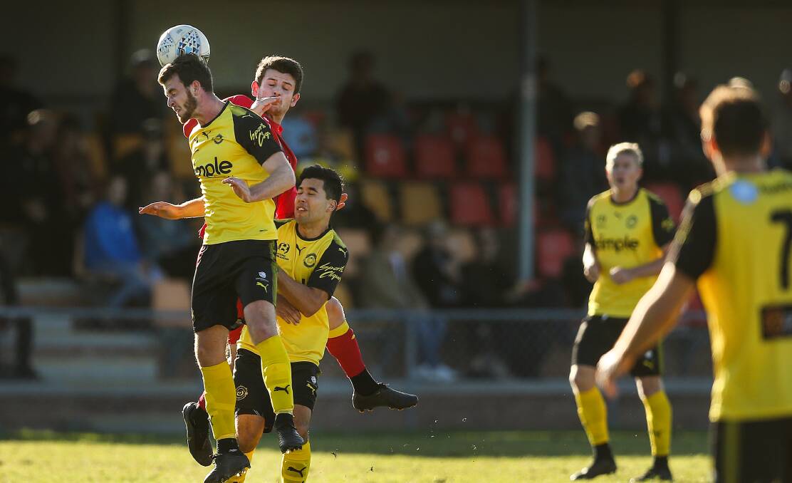 TIGHT BATTLE: Jaffa Tom Waller and Broadmeadow's Mitch Oxborrow contest a header at Magic Park on Sunday. Picture: Marina Neil