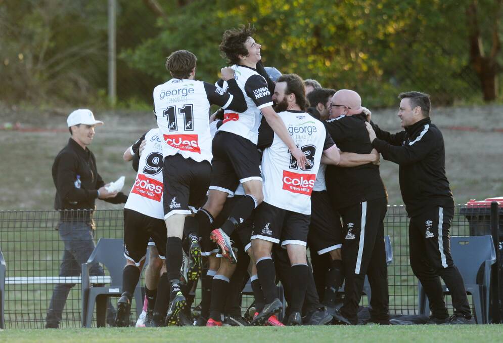 ALL IN: Maitland celebrate their winning goal in the fifth minute of stoppage time on Saturday at Cooks Square Park. Picture: Jonathan Carroll 