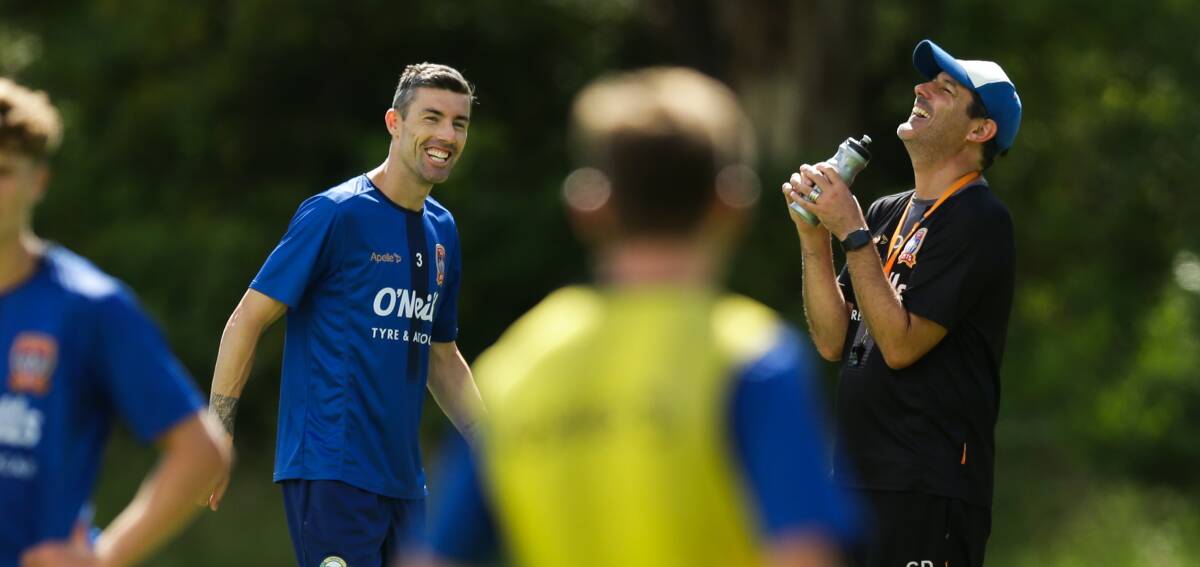 LIGHTER MOMENT: Jason Hoffman and coach Craig Deans share a laugh at training this season. Picture: Jonathan Carroll