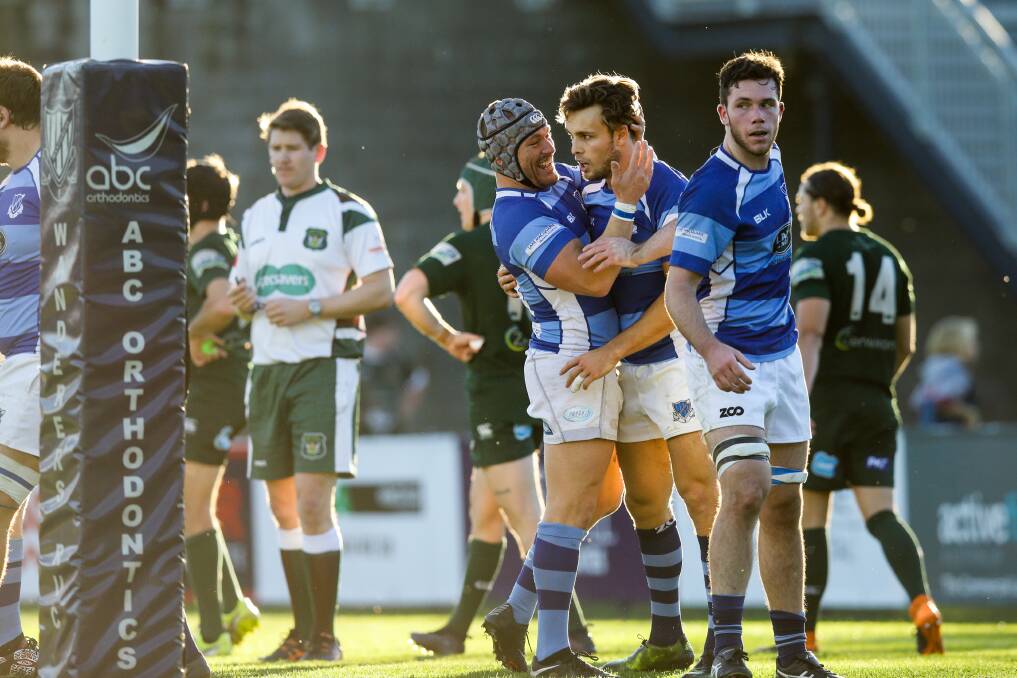 Bill Coffey and Josh McCormack celebrate a Wanderers try on Saturday. Picture: Jonathan Carroll