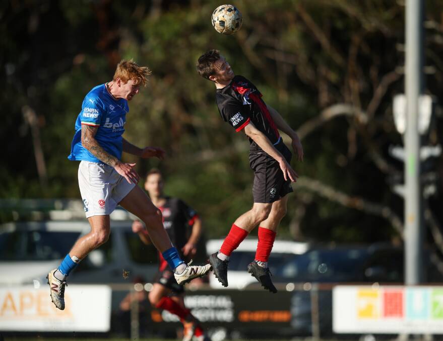 Tom Curran, right, in action for Edgeworth this season against Charlestown in the NPL. Picture by Marina Neil