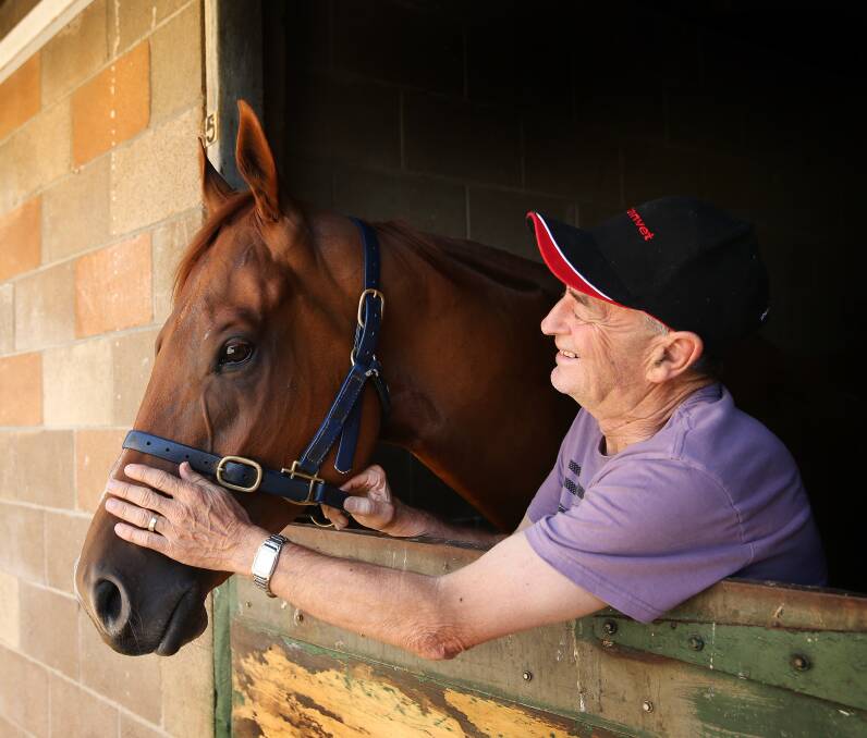 AT HOME: Popular Newcastle trainer Alan Scorse with former galloper Magicalease at his Chatham Street stables in 2017. Picture: Marina Neil