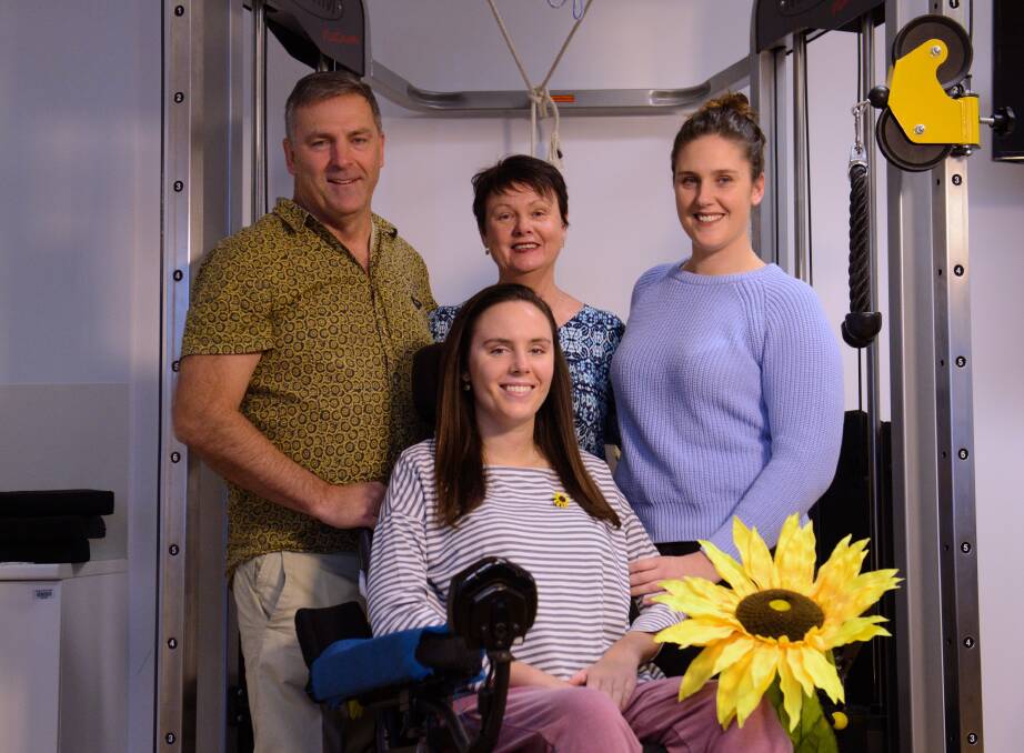 HUGE SUPPORT: Parents Peter and Sandy Collins, and sister, Emma Collins, with Jessica at Royal North Shore Hospital. Picture: Nick Moir 