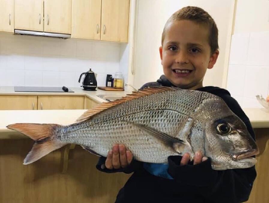 FISH OF THE WEEK: Warren Thompson and his son Travis, pictured, win the Jarvis Walker tacklebox and Tsunami lure pack for this 66cm, 2.8kg snapper caught off Stockton beach last Thursday.