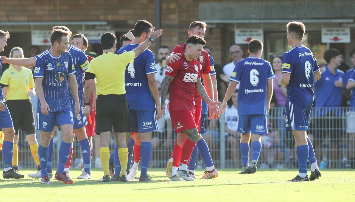 Broadmeadow's Keanu Moore heads to the sheds after copping a red card in the 36th minute against Newcastle Olympic at Darling Street Oval on Saturday. Picture by Max Mason-Hubers