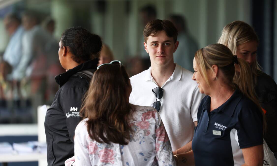 Lachlan Scorse, centre, and his mum, Lara Scorse, right, on Saturday at Newcastle Racecourse. Picture by Peter Lorimer