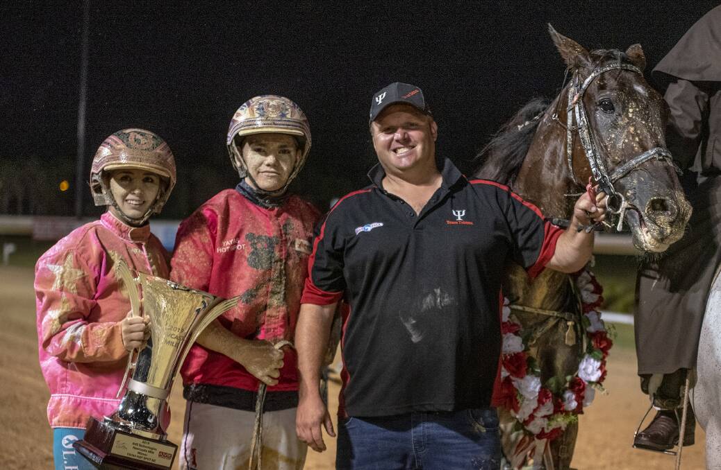 TOP TEAM: Co-trainer and Maximan driver Lauren Tritton, winning driver Lachie Manzelmann and trainer Shane Tritton with victor Yayas Hot Spot and the Newcastle Mile trophy on Friday night. Picture: HRNSW