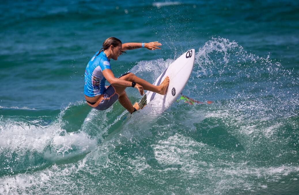 OPENING UP: Sarah Baum finds some room to move on her forehand in small waves at Dixon Park Beach on Tuesday en route to a first-round victory. Picture: Gary Luke Photographics