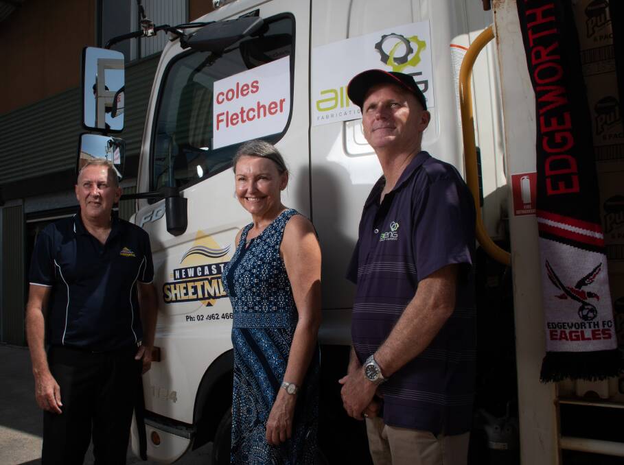 READY TO ROLL: Warren Mills, from Newcastle Sheetmetal and the Edgeworth Eagles, with Wallsend MP Sonia Hornery and Dale Arthur, from All Engineering Services. Picture: Simon McCarthy