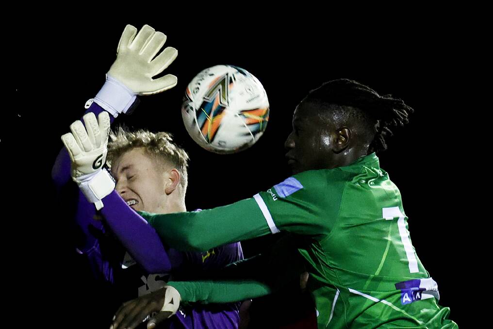 ALL IN: Zac Bowling battles with Ajak Riak during the round of 32 Australia Cup match between Bentleigh Greens and Broadmeadow at Kingston Heath Soccer Complex. Picture: Jonathan DiMaggio/Getty Images