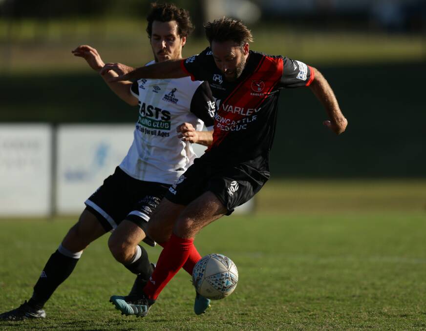 RESTED: Edgeworth's Josh Rose and Maitland defender Tom Davies battle during the Magpies' 2-1 win in round 12 this year. Picture: Jonathan Carroll