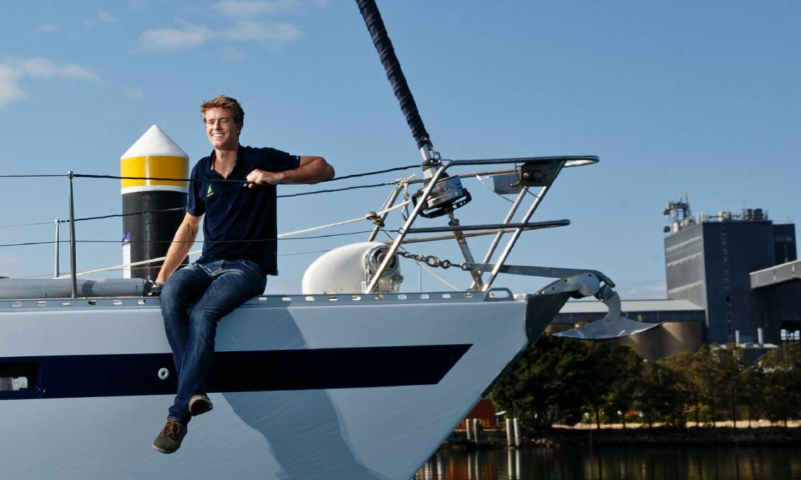 ON COURSE: Will Ryan on his grandfather's boat at Newcastle Cruising Yacht Club. Picture: Max Mason-Hubers