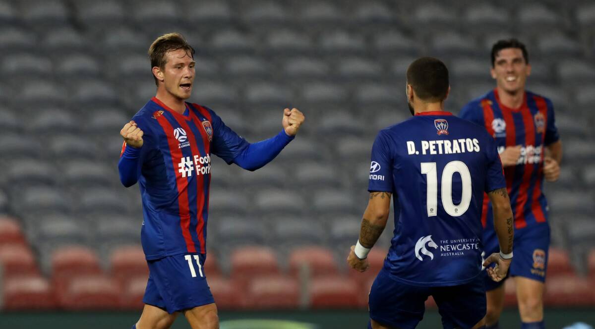 GOAL IN SIGHT: Nick Fitzgerald celebrates scoring against Melbourne City at an empty McDonald Jones Stadium on March 23. Picture: Getty Images