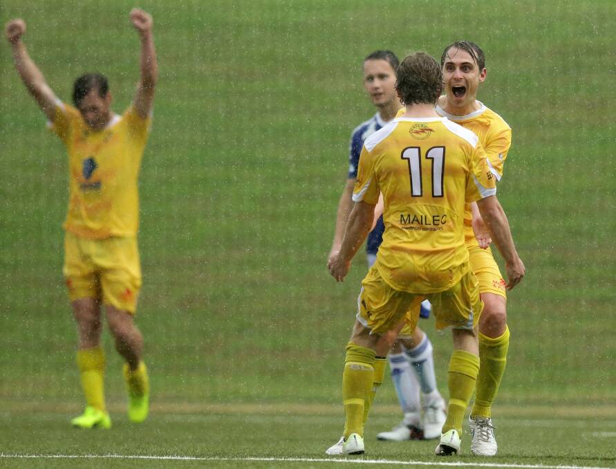 PARTY TIME: Lambton Jaffas forward Rhys Tippett celebrates his goal with Luke Remington as Ben Hay rejoices in the background on Sunday at Lake Macquarie Regional Football Facility at Speer Point. Picture: Jonathan Carroll