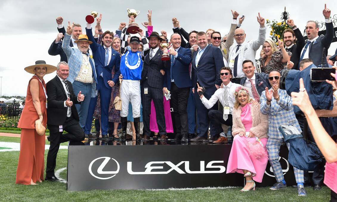 The winning Melbourne Cup team celebrate. Picture Getty Images