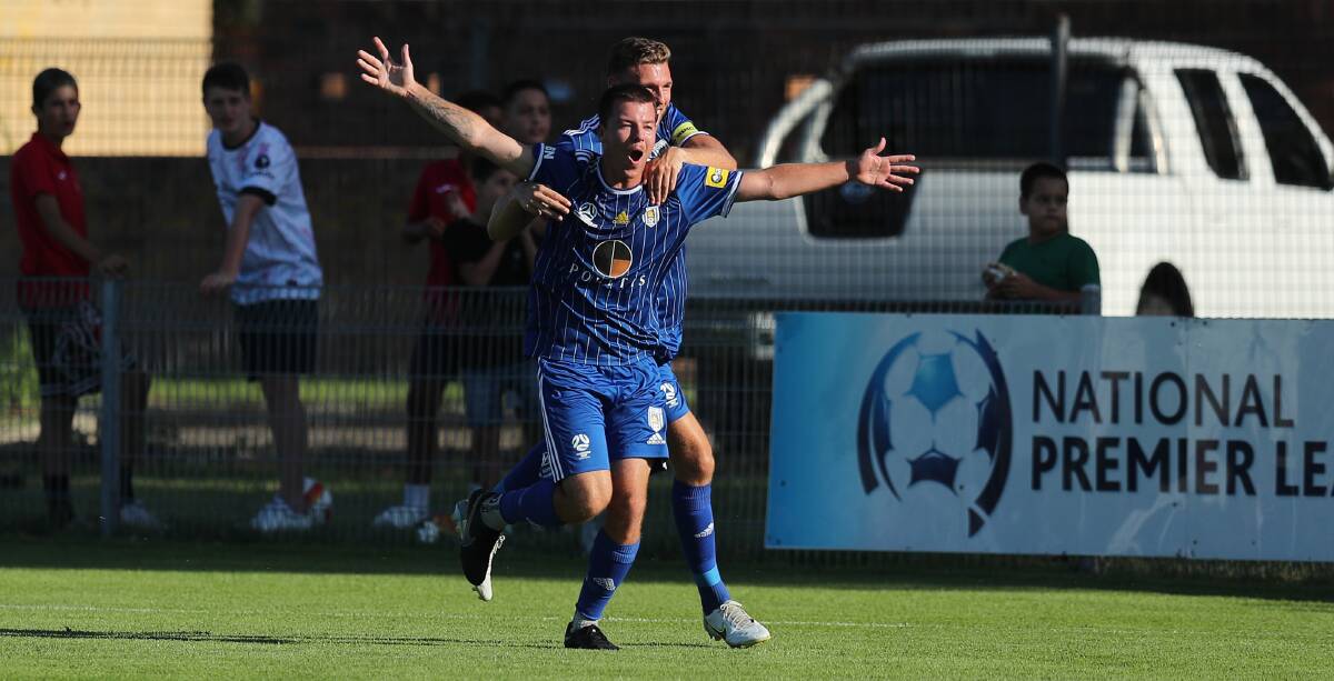 Dylan Burston, front, and Marcus Duncan were unused substitutes in Newcastle Olympic's 5-2 NPL victory over Lake Macquarie on Saturday. Picture by Max Mason-Hubers