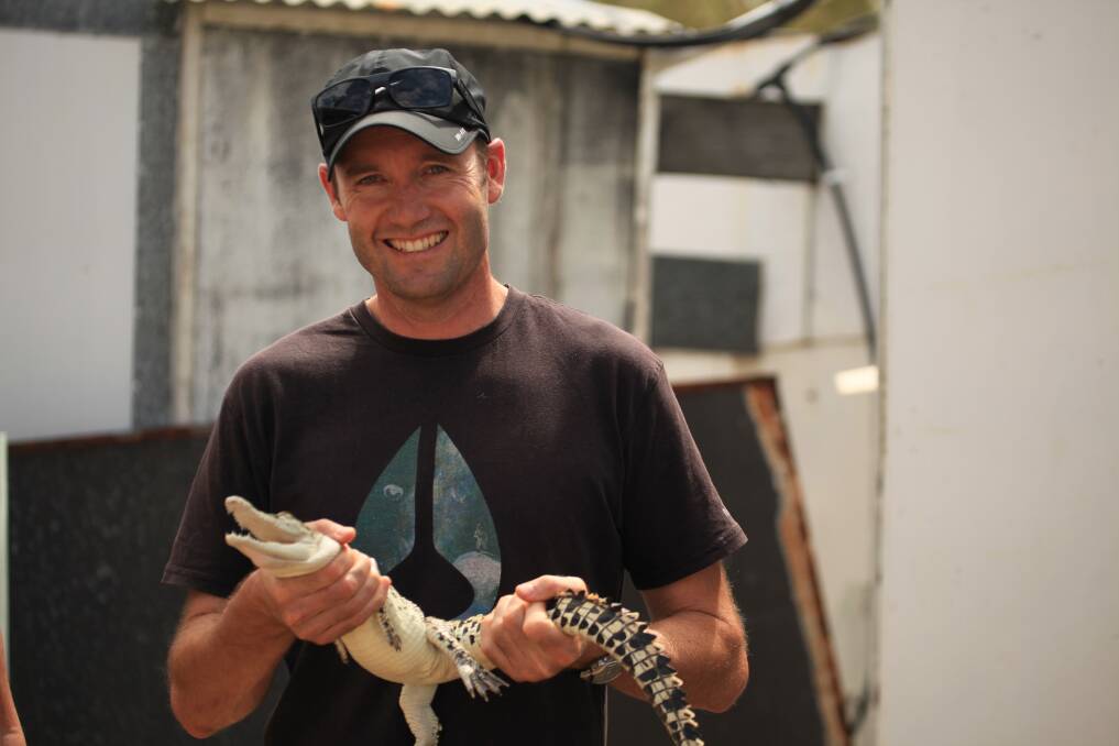 BREAKTHROUGH:Professor Brett Nixon with a saltwater croc