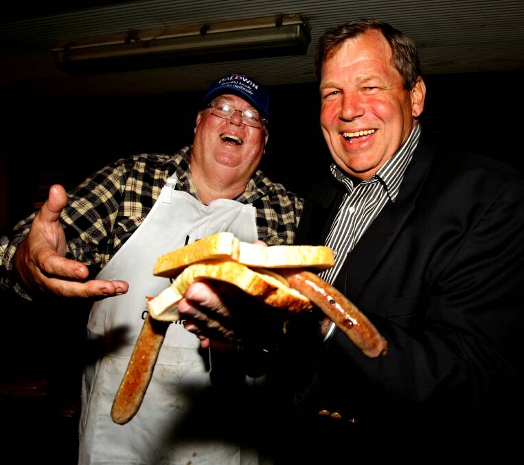 ELECTION SNAG: Baldwin enjoys campaign night in Raymond Terrace in 2010 with  typical election fare. 