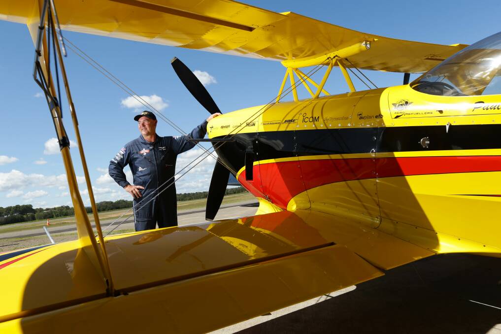 Acrobatic pilot Paul Bennet will be wowing Novocastrians in the sky tonight. Picture by Jonathan Carroll