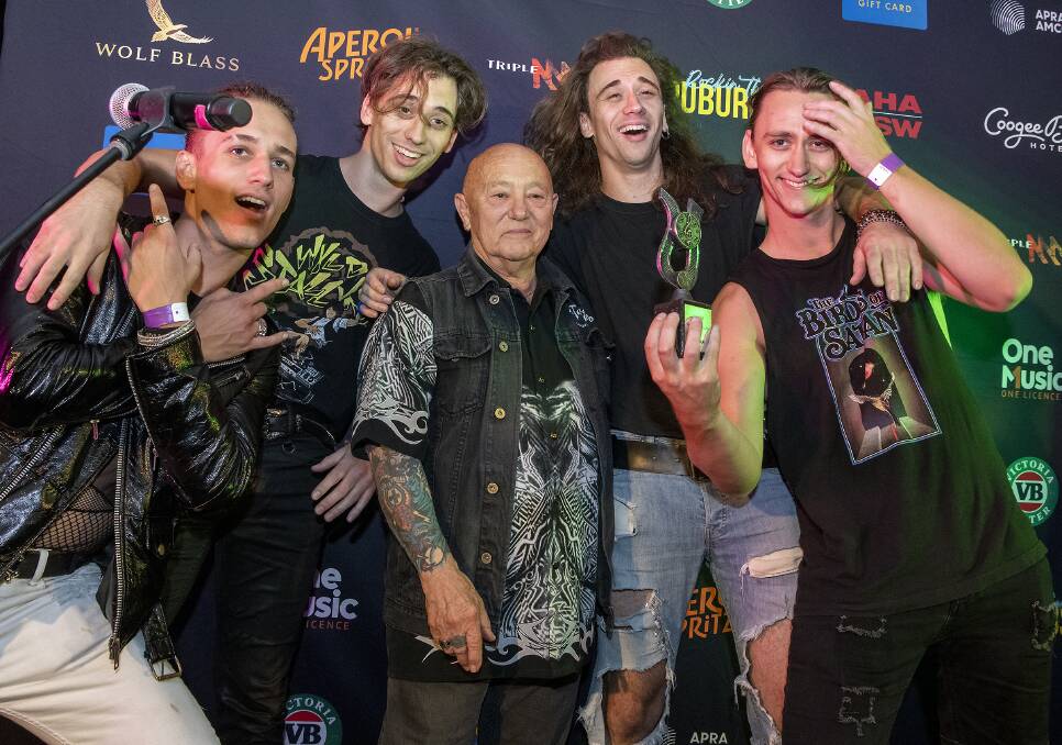 The winners Wicked Things with Rose Tattoo's Angry Anderson. Picture by Swamp House Photography