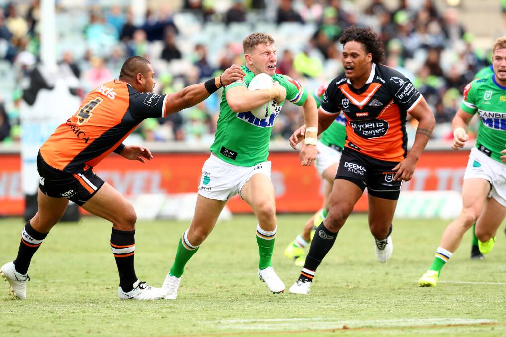 HIT UP: Wests Tigers playing Canberra Raiders in round one of the 2021 NRL season. Picture: Keegan Carroll