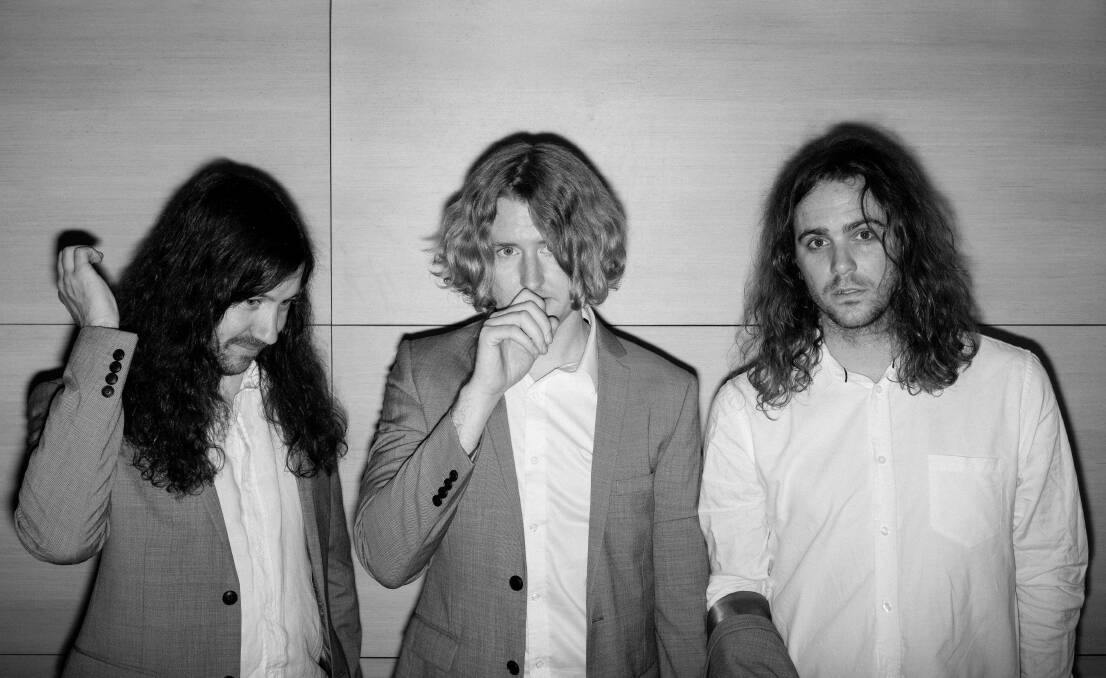 THREE-PIECE: Positive Rising: Part 1 is the first DZ Deathrays album Lachlan Ewbank, from left, has recorded with Simon Ridley and Shane Parsons. 