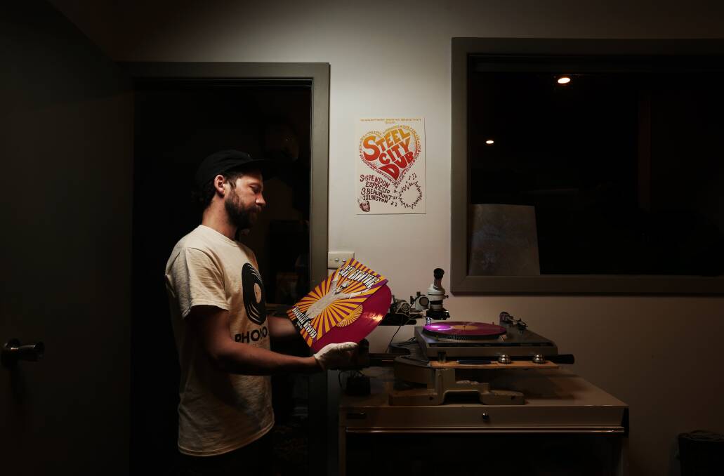 PhonoLab co-owner Dan Crabb, looking over a completed custom record.