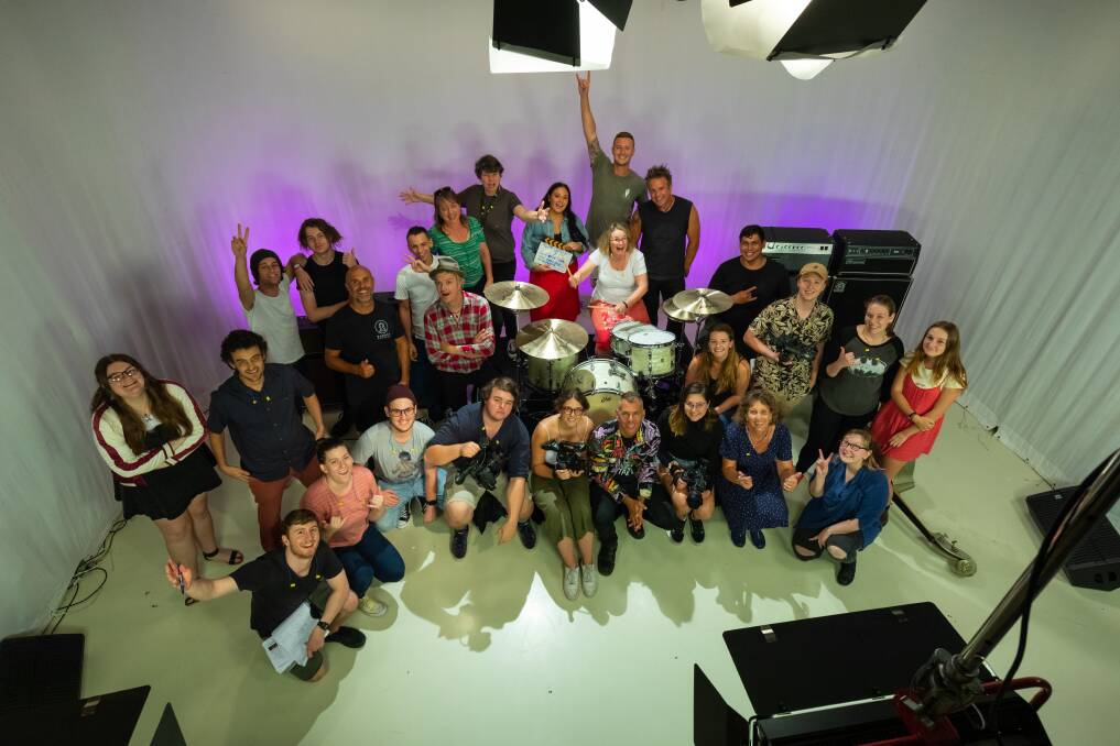 IT'S A WRAP: University of Newcastle students on set with The Living End during the filming of Not Like The Other Boys.