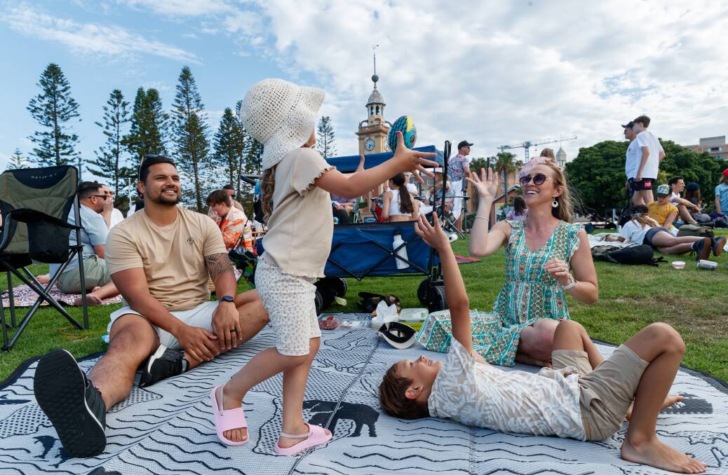 Rob Puli'uvea enjoying the New Year's festivities at Newcastle Foreshore with his children Leilani, 4, and Bentley, 6, and his wife Emma. Picture by Max Mason-Hubers