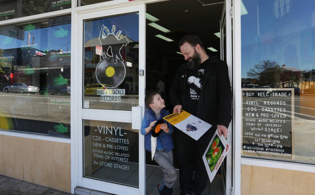 FAMILY BUSINESS: Mitchel Eaton with his son Cash, who loves The Ramones. 