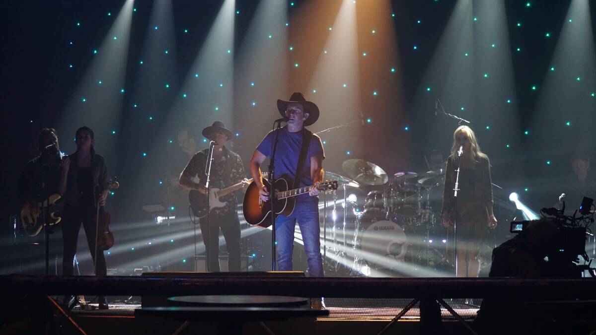 LIVE: Lee Kernaghan on stage with The Wolfe Brothers.