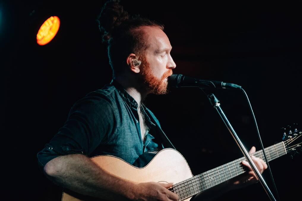 HOT: Newton Faulkner sweated up a storm in the balmy conditions.